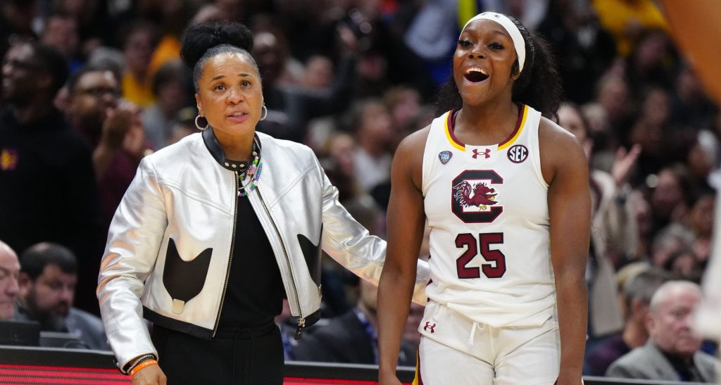 South Carolina Gamecocks guard Raven Johnson (25) and head coach Dawn Staley