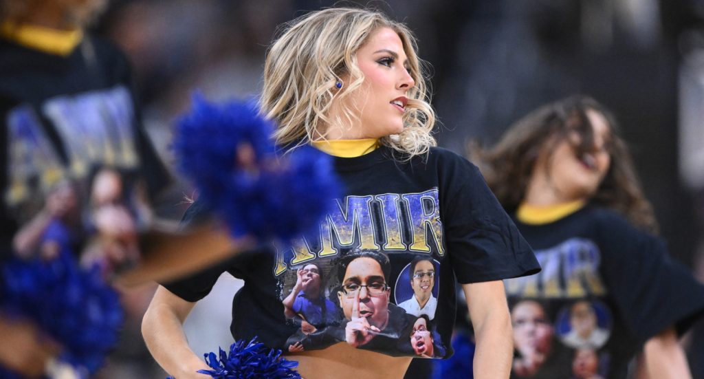 McNeese State cheerleaders wearing shirts with manager Amir Khan's image during a March 22, 2025 game against Purdue.